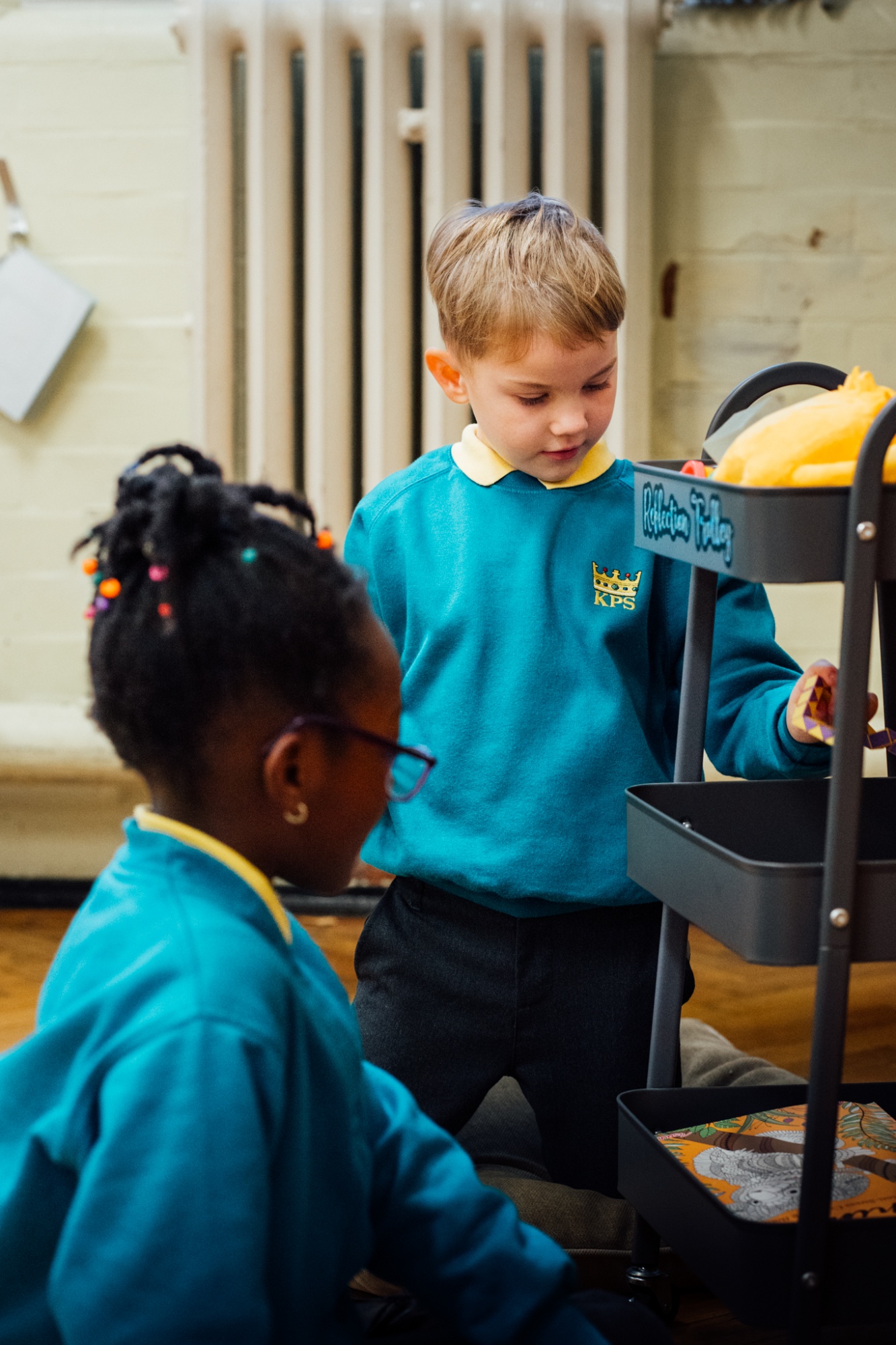 two children playing in classroom