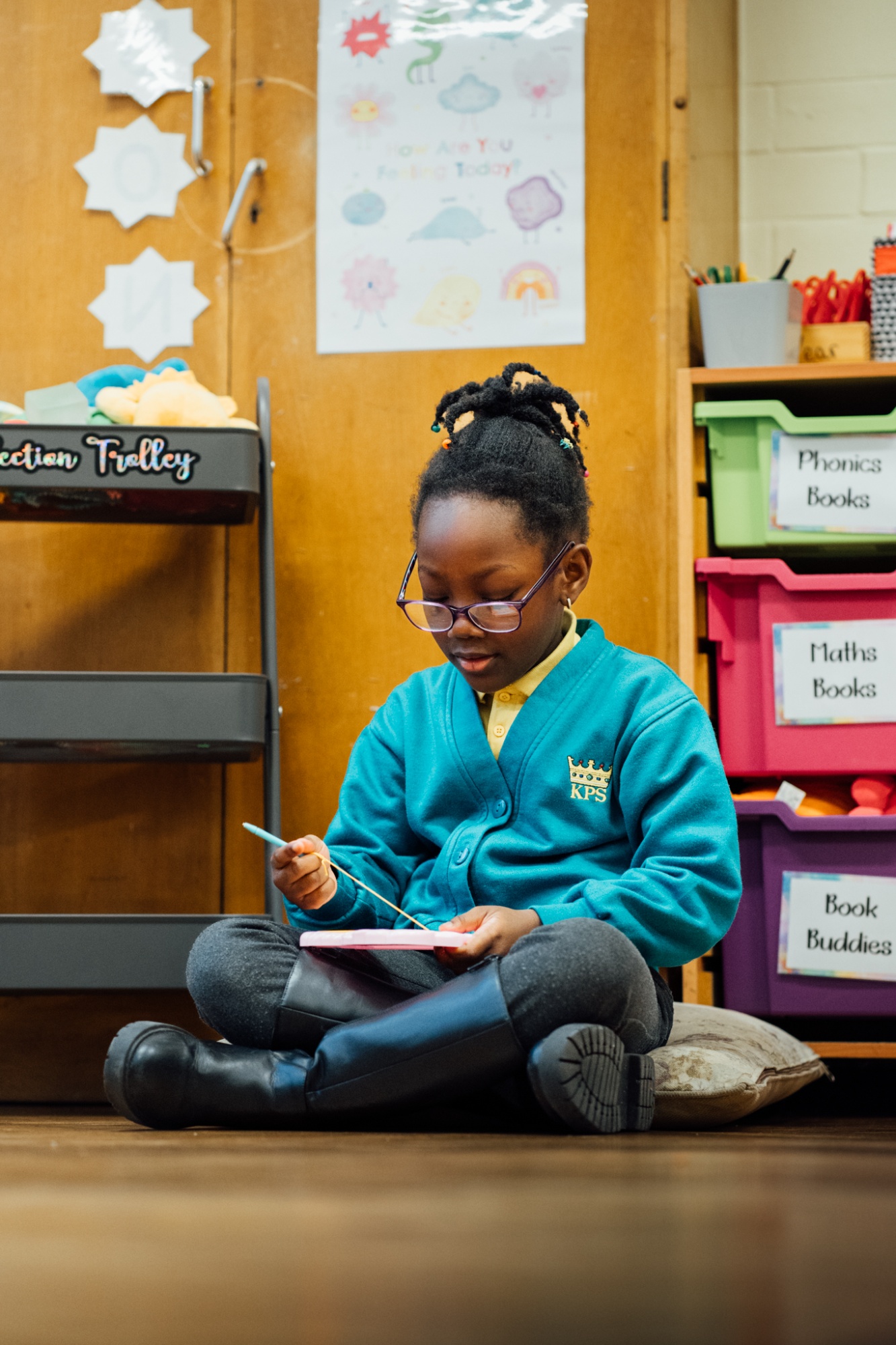 student sat on floor reading at breaktime