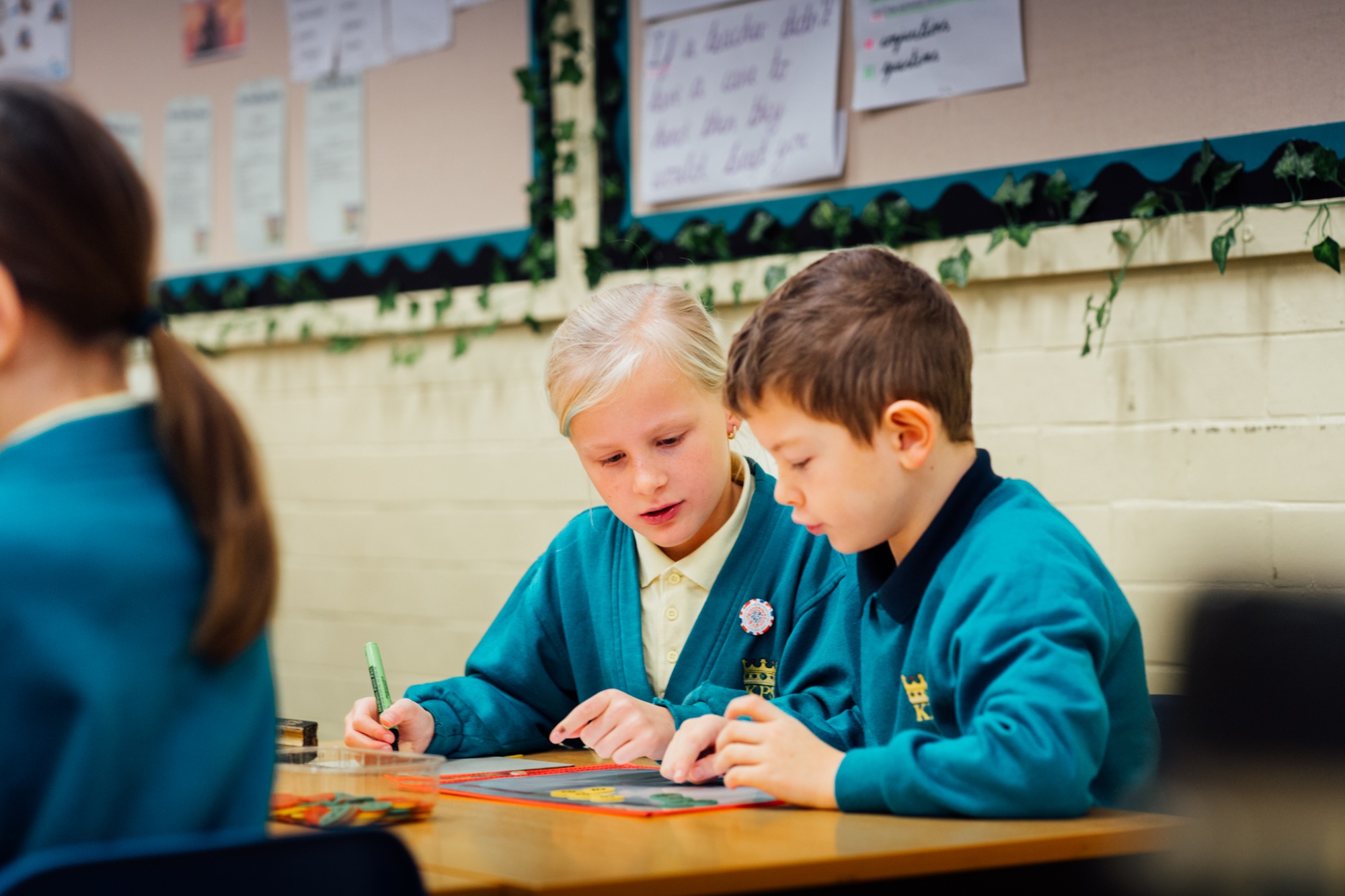 two students working together in lesson